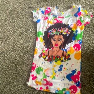 Melanin top T-shirt colorful paint coloring on it. Hasn’t been worn